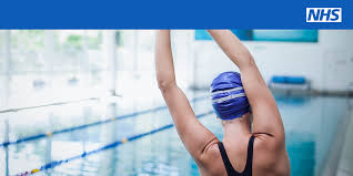 NHS image of woman at the pool getting ready to swim