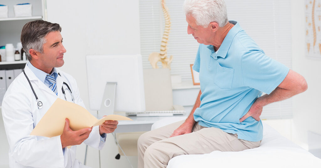 patient seeing doctor about back pain